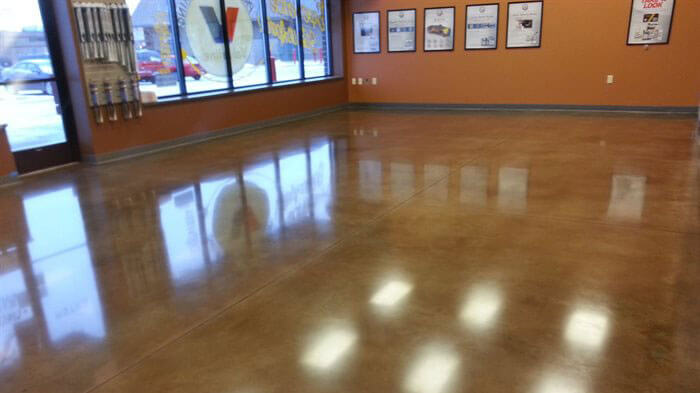 concrete floor with orange walls.
