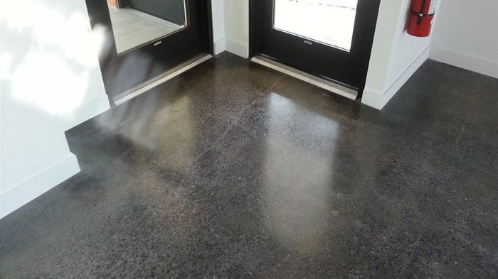 Dark concrete flooring.
